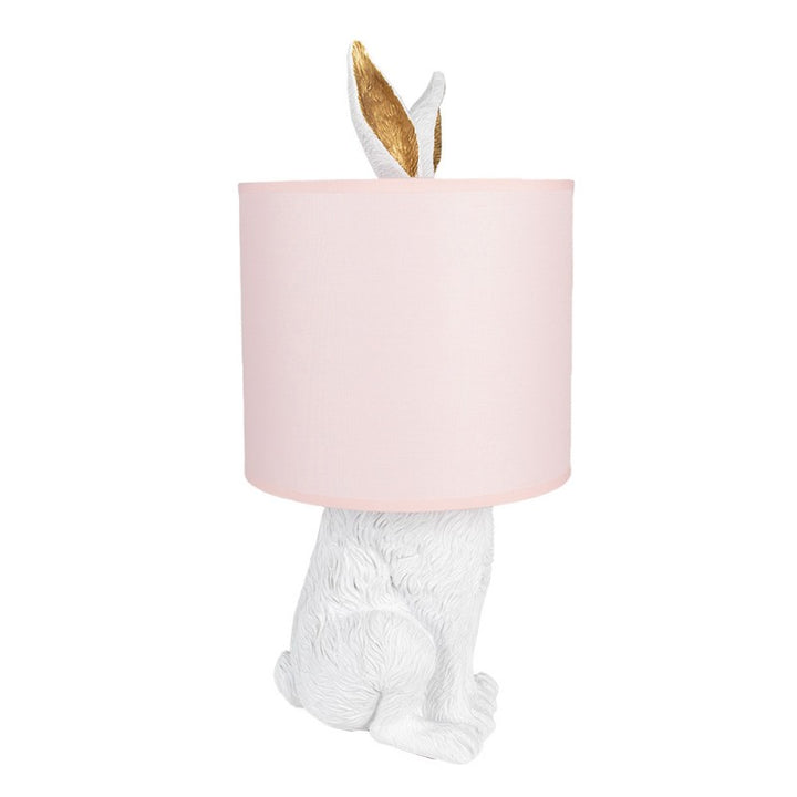 Tischlampe Kaninchen – elegante Designlampe aus Polyresin in Weiß mit rosafarbenem Lampenschirm